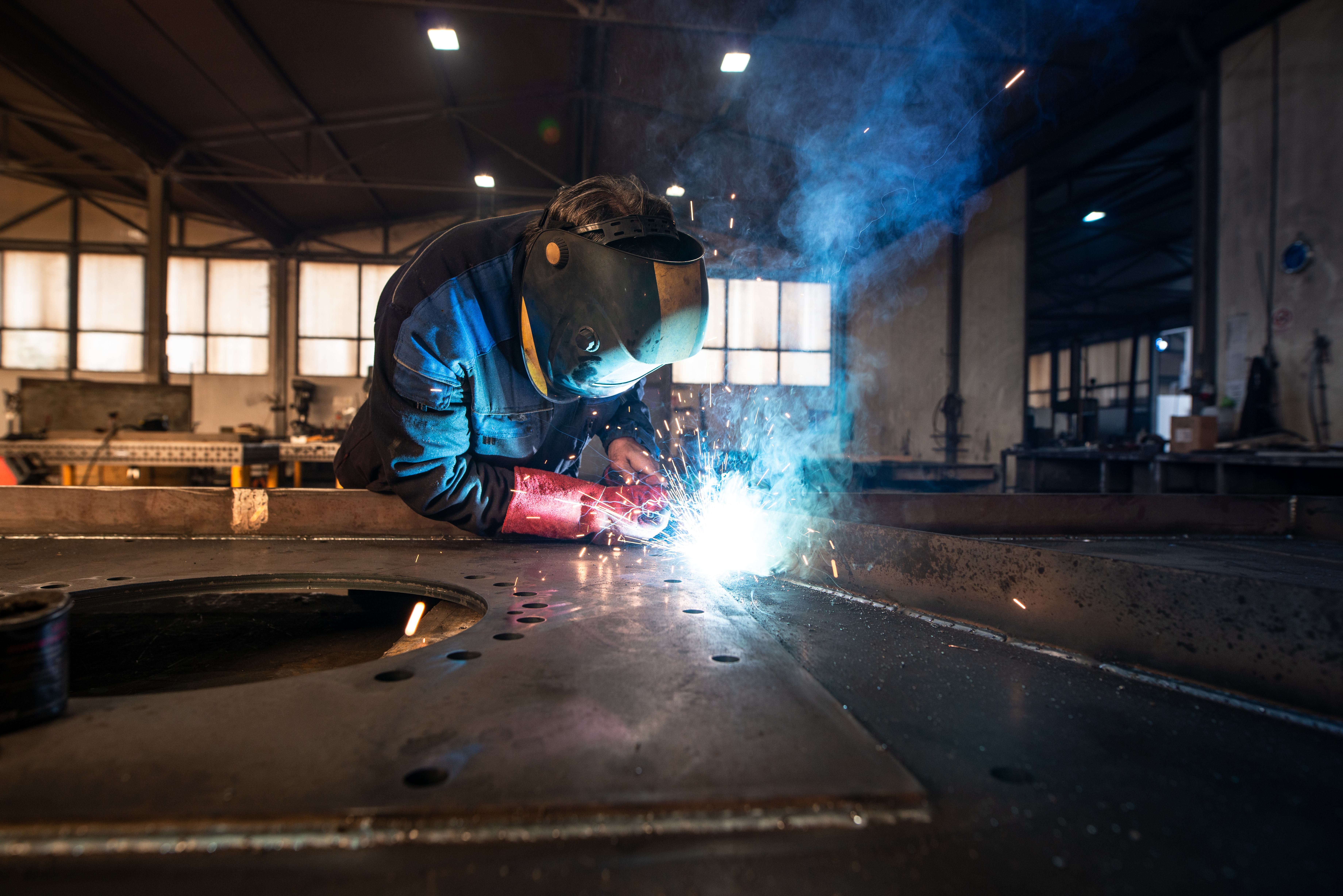 Worker welding sheet metal